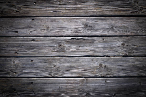Dark wooden background texture. Old fence panels with natural patterns.