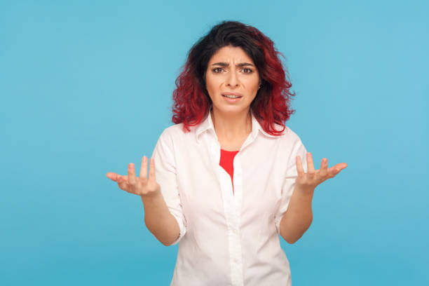 what do you want? portrait of annoyed hipster woman with fancy red hair standing with raised hands - rudeness manager emotional stress asian ethnicity imagens e fotografias de stock