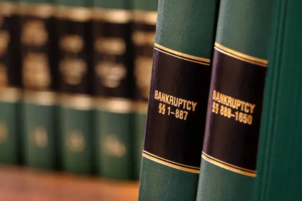 Bankruptcy law books on shelf bookshelf for legal reference