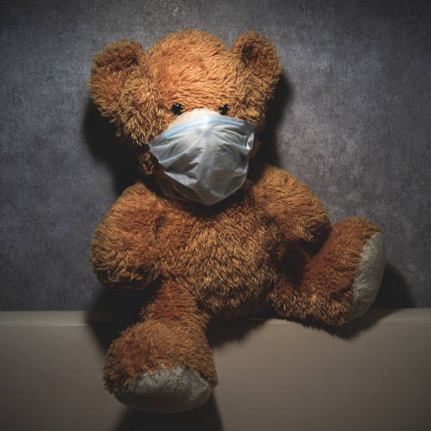 istock medical teddy bear mask in self-isolation and quarantine 1218809035