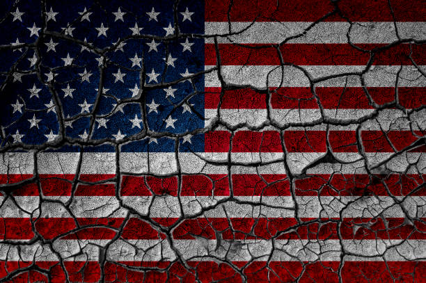 istock USA flag on cracked wall 1218810102