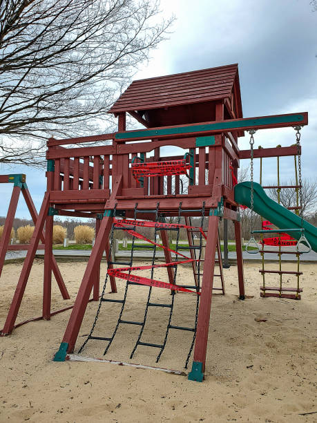 istock red tape wrapped around playground 1218810175