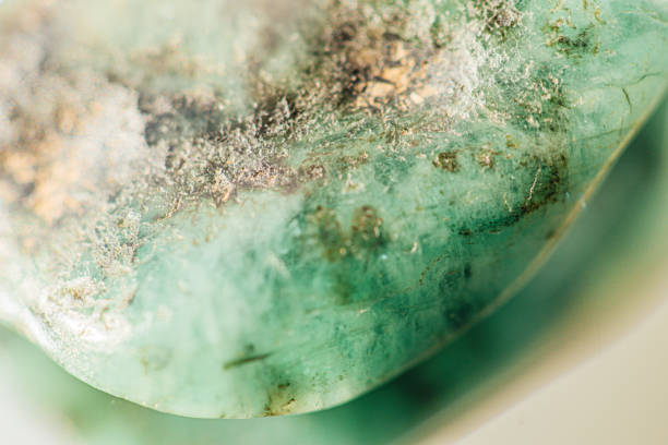 istock Raw emerald stone close-up macro shot 1218810263