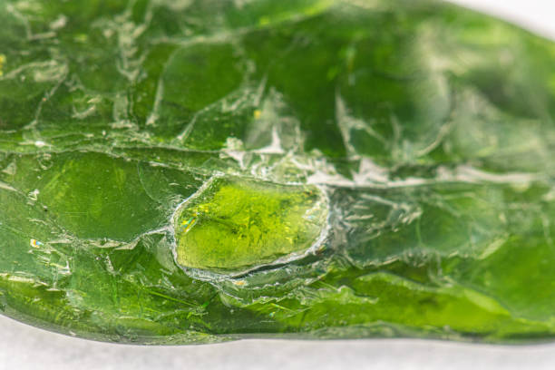 istock Raw emerald stone close-up macro shot 1218810378