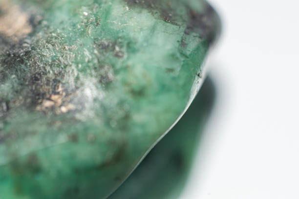 istock Raw emerald stone close-up macro shot 1218810583