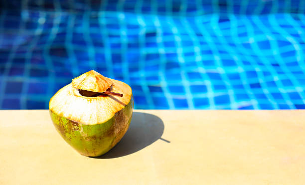 istock Coconut water drink by the Swimming pool 1218810707
