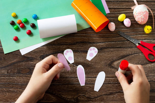 istock Instruction, step 5. Making the packaging in the form of carrots and the Easter Bunny. Handmade. Project of children's creativity, handicrafts, crafts for kids. 1218811556