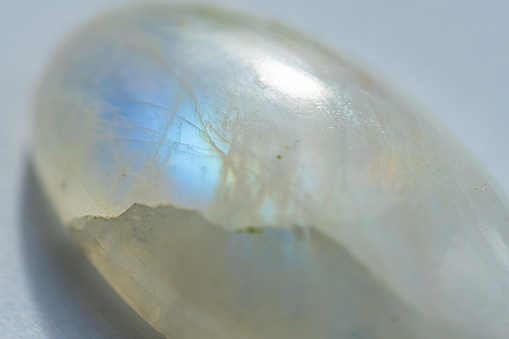 Close-up of a moonstone crystal on a white background.