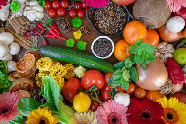 istock Colorful composition of assorted vegetables: tomato, egg,garlic,lemon,salad,mango,onion,lettuce, cabbage, onions, bell peppers,Studio photography. No people. Healthy eating concept. Organic and fresh food concept.on  background 1218813107