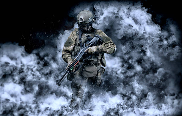 American soldier comes out of the smoke on the battlefield. The concept of military special operations. Computer games. stock photo