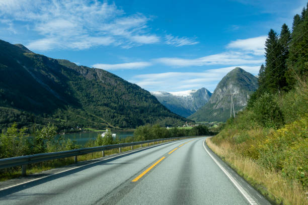 istock Norwegian mountain road with Josteldalsbreen glacier in the background 1218813477