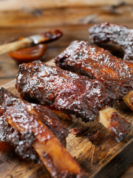 Slow Roasted Beef Ribs with BBQ Sauce Slow Roasted Beef Ribs with BBQ Sauce barbecue beef stock pictures, royalty-free photos & images