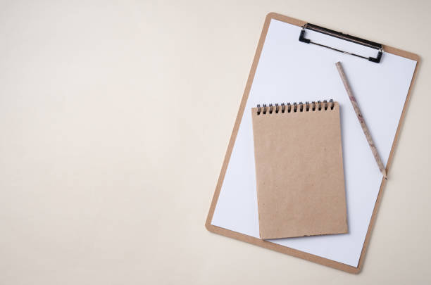 istock Home work. zero waste  flat lay with craft note, tablet and pencil  on yellow background 1218816271