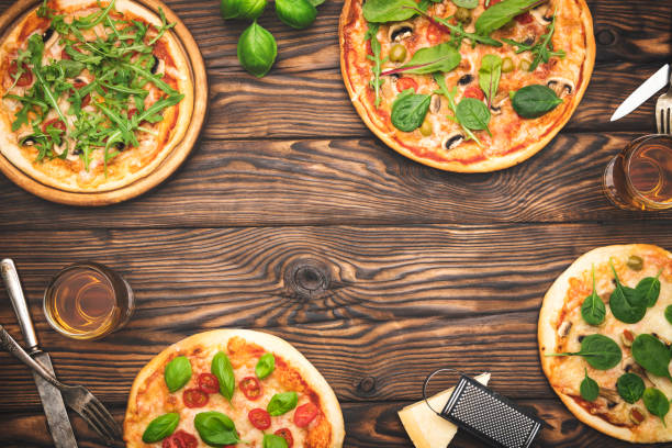 istock Delicious homemade pizza on wooden table 1218817882