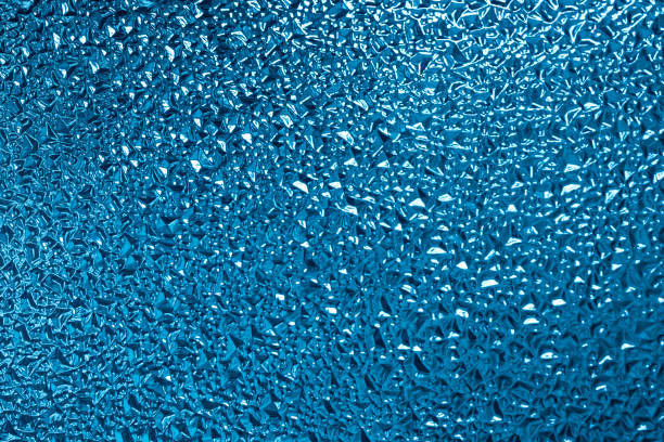 istock abstract blue metal or glass background water effect 1218820870