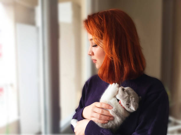 istock Cat Plays With Hair 1218823545