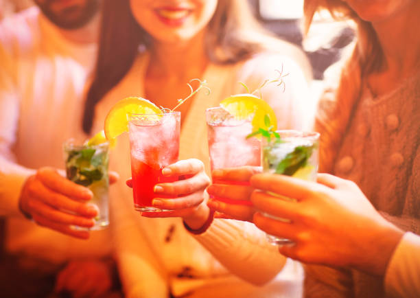 istock Friends drinking cocktail at party 1218823598