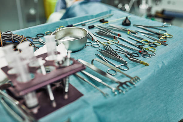 istock Surgical instruments in the operating room, laid out on a sterile table on a special blue tissue. The concept of medecine, surgery, sterile area. Plastic surgery. Selective focus 1218823683