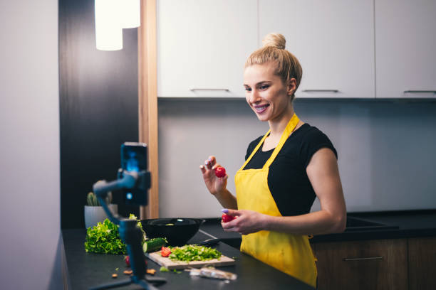 istock Woman Vlogging In The Kitchen At Home 1218824311