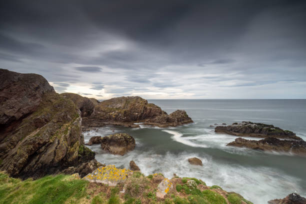 istock Rough scottish north east coast long exposure extreme clouds sky long exposure hdr 1218824856