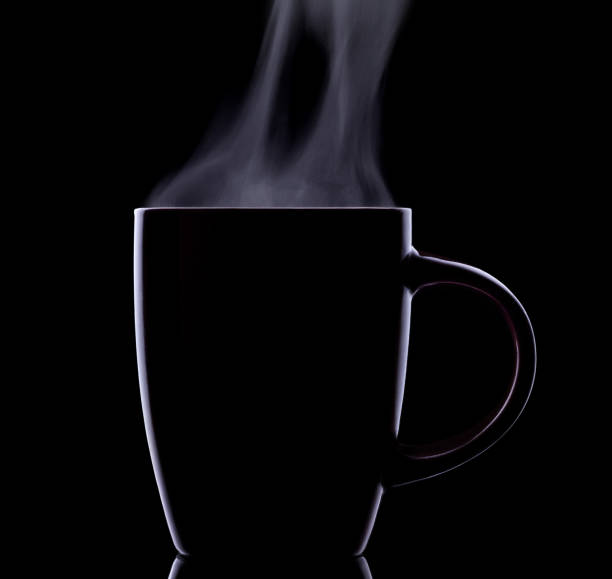 istock Cup of hot drink on black. 1218826169