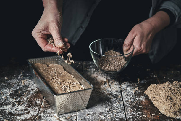 istock Preparing Healthy Brown Bread with Sunflower Seeds 1218826425
