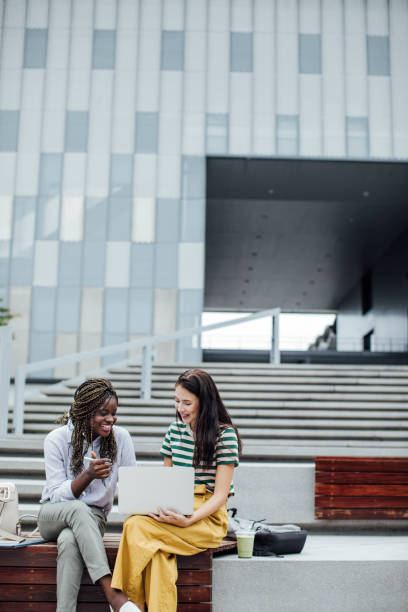 istock Learning Together is Fun: Two Female College Students Studying Together on the Campus 1218826467
