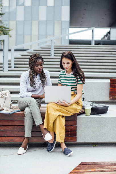 istock Two Female College Students Studying Together Using.a Laptop on the Campus 1218826469