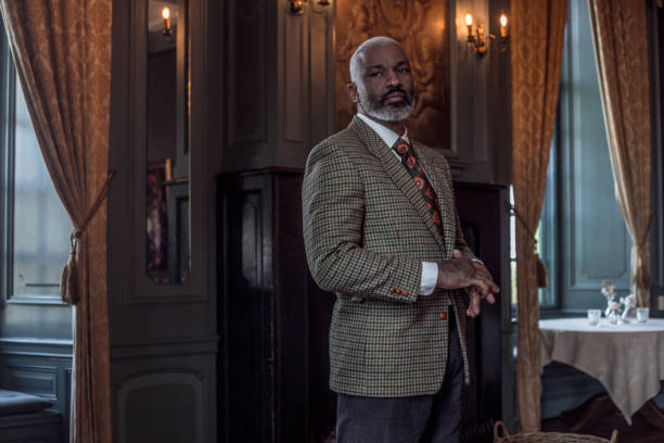 Portrait of a black vintage country gentleman alone in a stately home Portrait of a black vintage country gentleman in a stately home live action role playing photos stock pictures, royalty-free photos & images