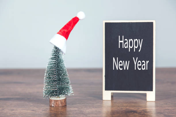 istock holiday hat and chalkboard on desk 1218828640