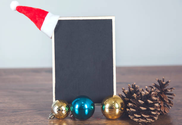 istock holiday hat and chalkboard on desk 1218828676