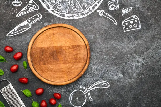 Photo of Pizza cutting board and chalk drawings