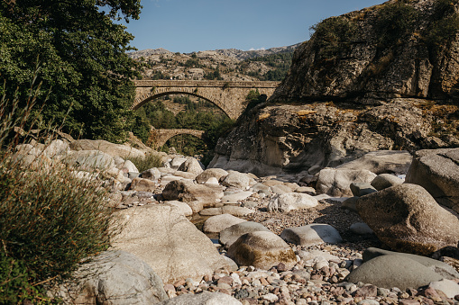 Photo of a stone bridge in Canyon river golo in Corsica, France.
