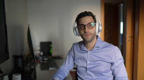 istock Young businessman on a video chat / online lesson at home 1218830236
