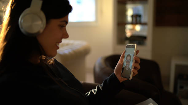istock Young woman using smartphone for video call - calling her boyfriend 1218830254