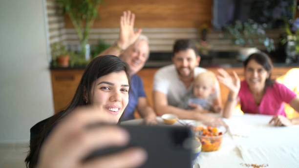 istock Family doing a video chat with mobile phone at home 1218830260