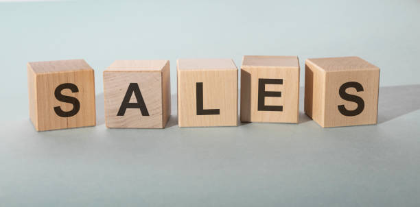 istock Word SALES on wooden cubes on grey blue background 1218831404