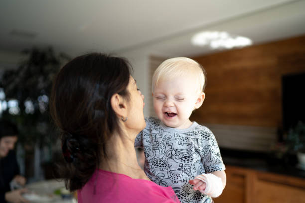 istock Grandson playing with grandmother at home 1218831536