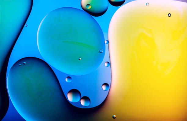 istock Colourful patterns of oil drops in water 1218832207