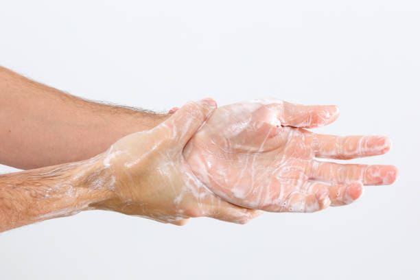 istock Close up image of washing hand against white background 1218834534