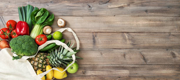 istock Fresh fruits vegetables cotoon bag Tomato cucumber broccoli pineapple 1218835448