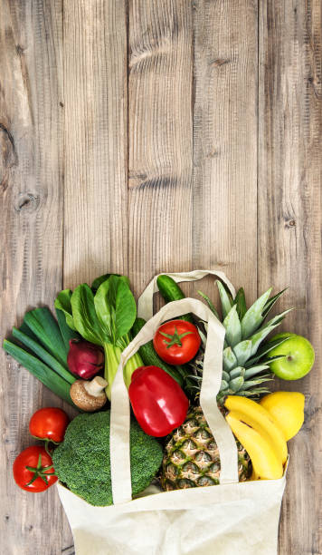 istock Vegetables fruits cotoon bag Tomato cucumber broccoli pineapple 1218835453