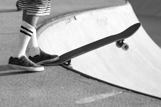 istock Skateboarder ready to drop a bowl in black and white 1218839895