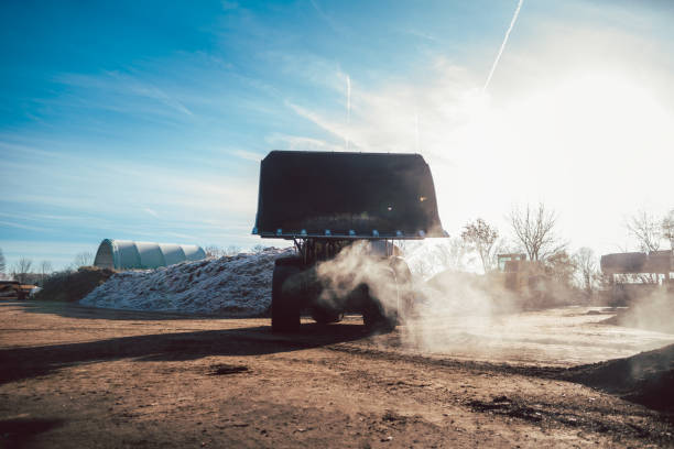 istock Bulldozer putting biomass on pile for composting 1218842770