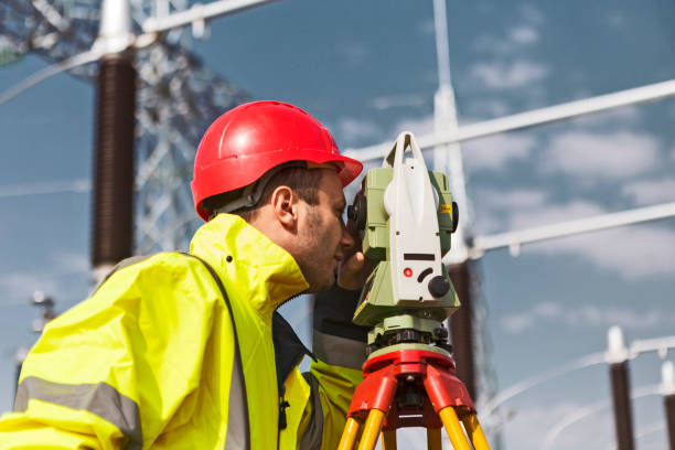 istock Engineer at electricity station looking through measuring device 1218845698