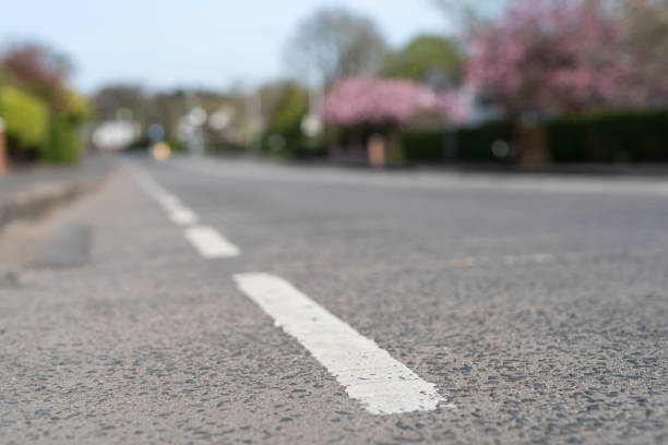 Road markings on an empty suburban road in spring