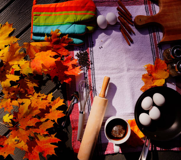istock Autumn maple leaves with kitchen tools and food materials 1218847859