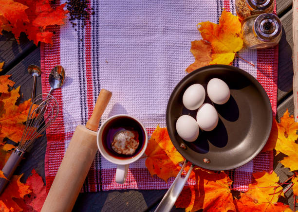 Autumn maple leaves with kitchen tools and food materials
