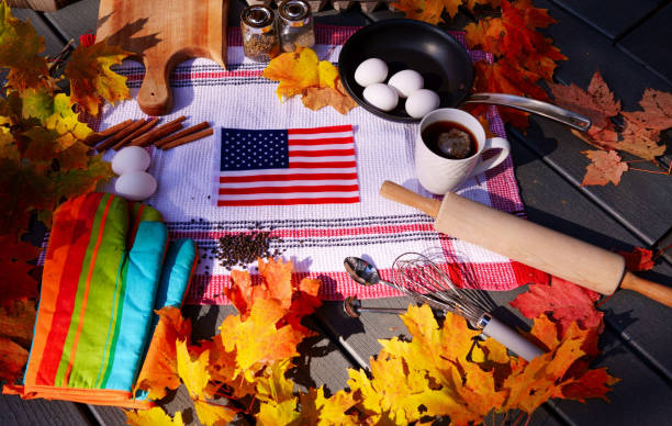 istock Autumn maple leaves with kitchen tools and food materials，American flag in the middle 1218848029