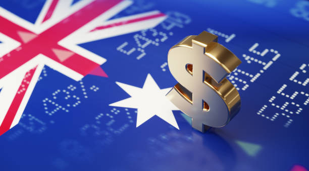 Gold Colored Dollar Sign Sitting over Blue Financial Bar Graph - Stock Market and Finance Concept Australian dollar sign sitting over Australian flag and blue financial bar graph. Selective focus. Horizontal composition with copy space.  Australian stock market and finance concept. australian dollar stock pictures, royalty-free photos & images